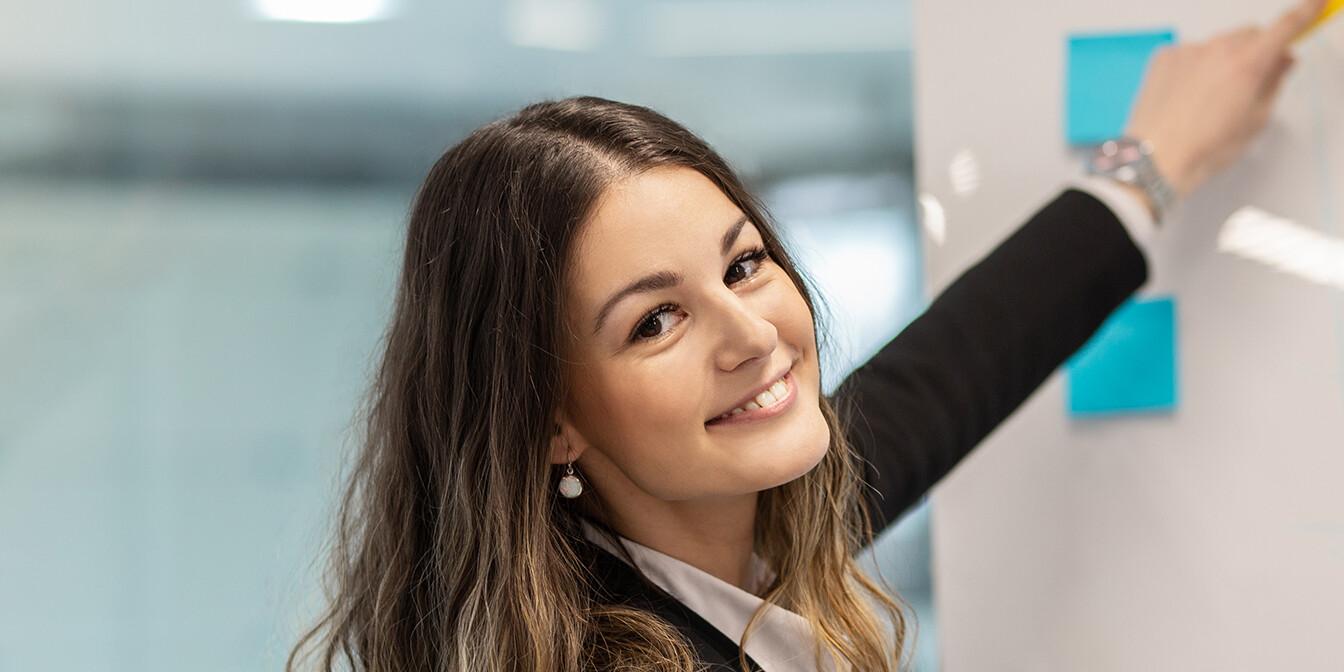 Smiling professional woman reflecting the traits of good leadership