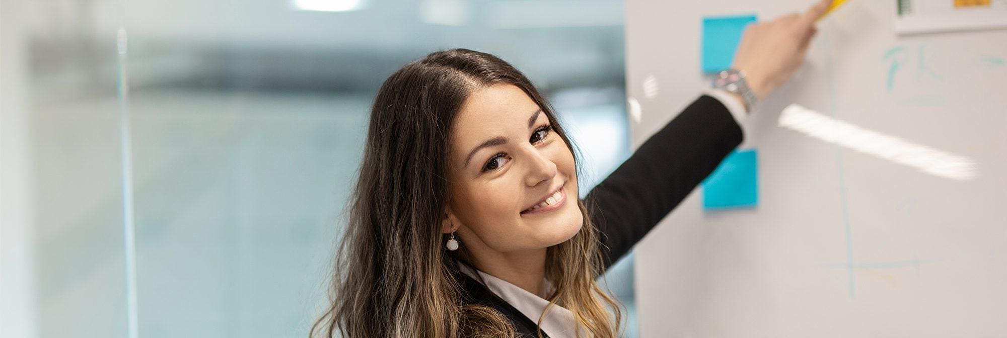 Smiling professional woman reflecting the traits of good leadership