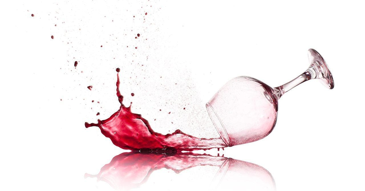 Spilled wine glass representing freedom from alcoholism after years of addiction