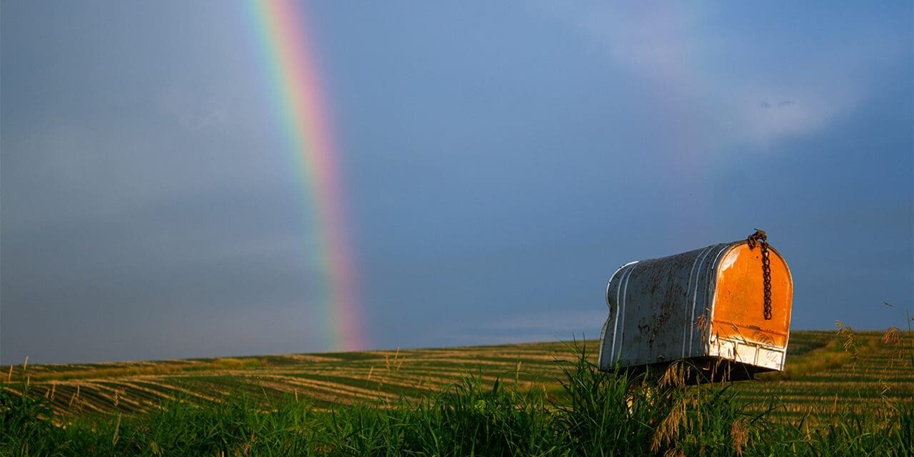 rainbow stretching across a cloudy sky, God's grace