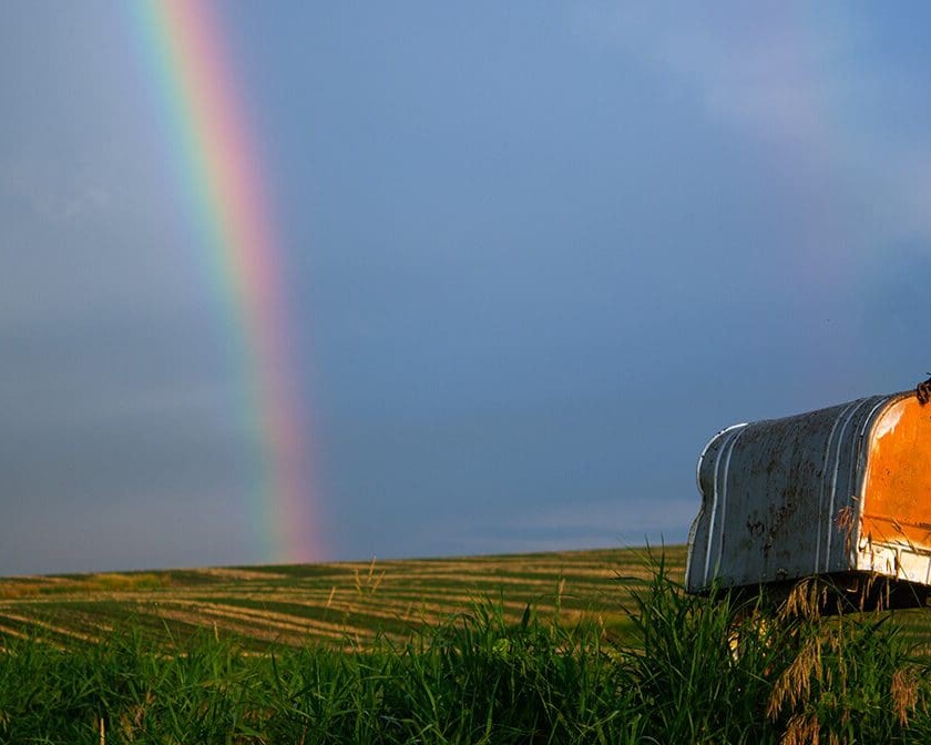 rainbow stretching across a cloudy sky, God's grace