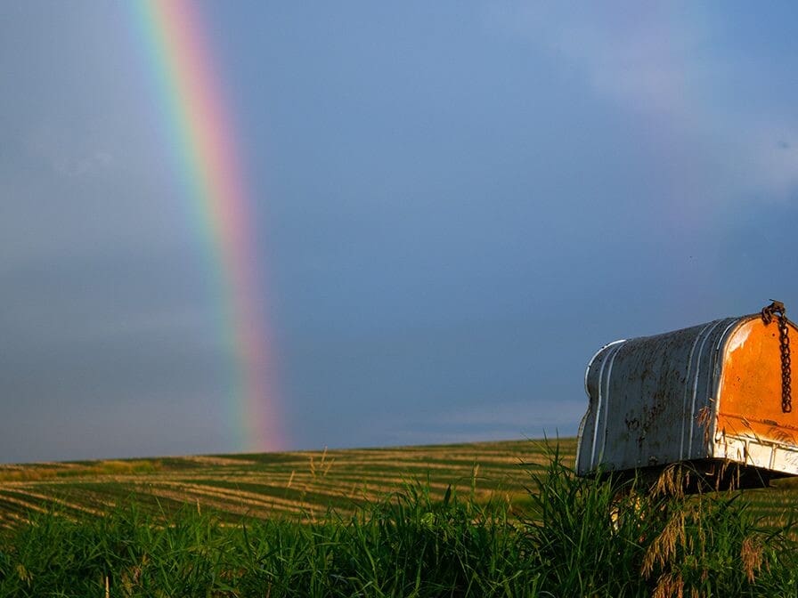 rainbow stretching across a cloudy sky, God's grace