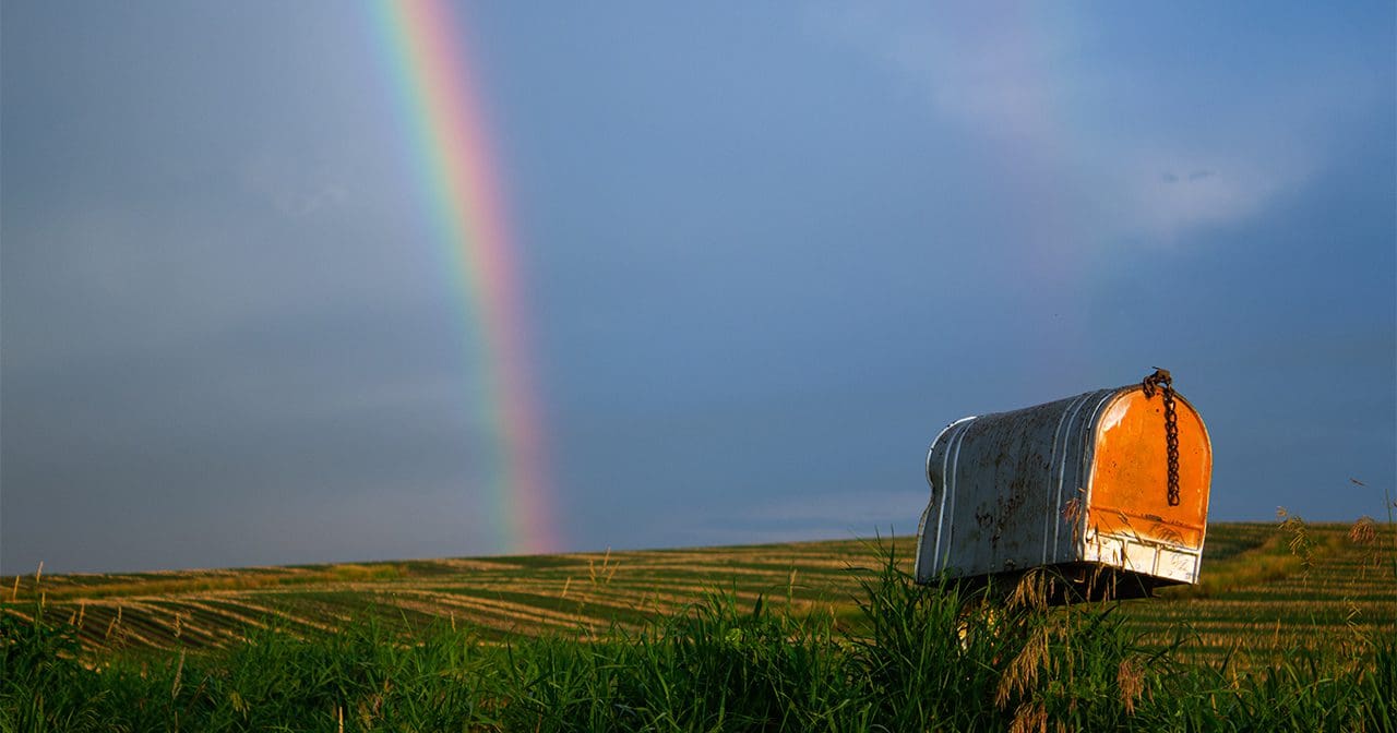 rainbow stretching across a cloudy sky, God's grace