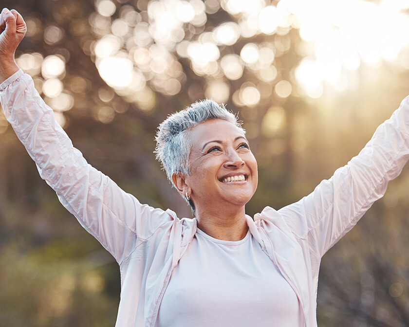 Woman rejoicing that she is cancer-free. cancer healing testimony