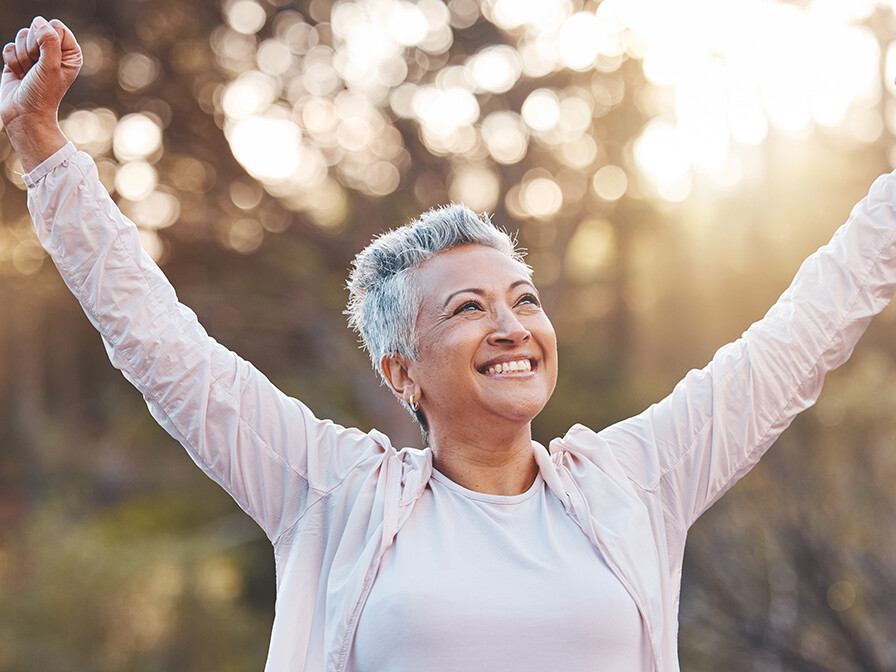 Woman rejoicing that she is cancer-free. cancer healing testimony