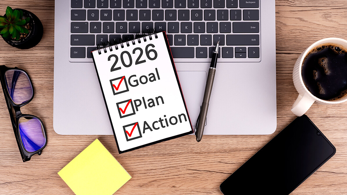 writing new year goals in a journal to plan for 2026