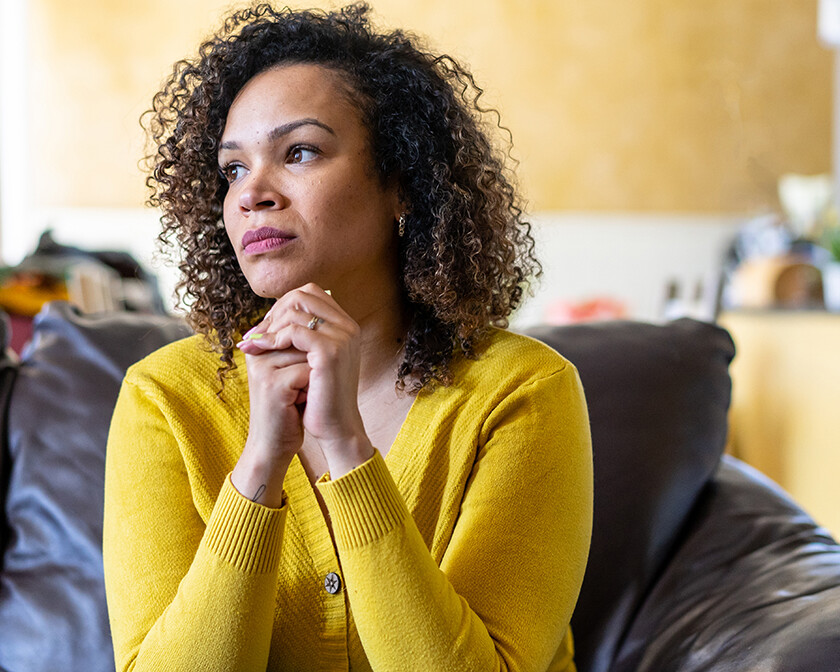 Tormented no more; woman sitting quietly, reflecting Shirley's journey from anxiety to peace