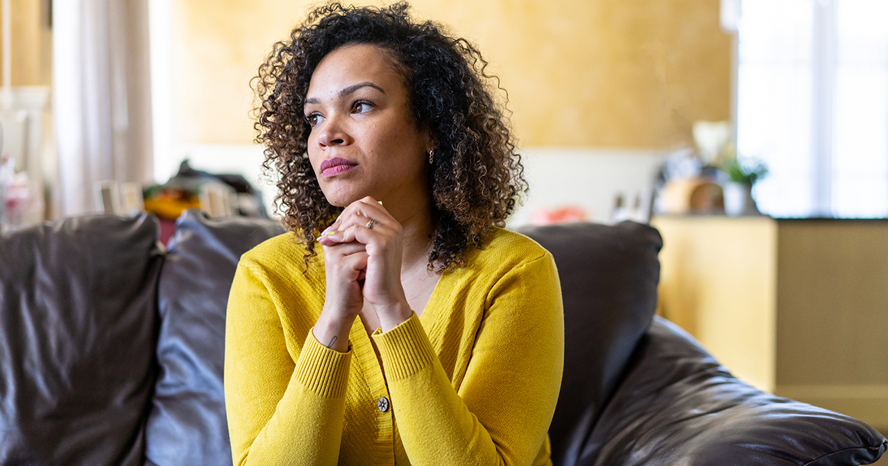 Tormented no more; woman sitting quietly, reflecting Shirley's journey from anxiety to peace