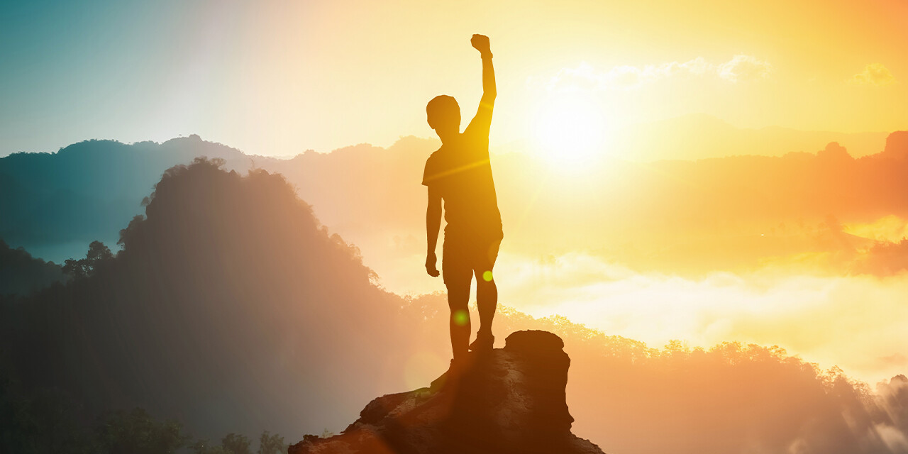All Your Might - Secure in who you are - in your identity in Christ. Image shows victorious person silhouetted on a mountaintop.
