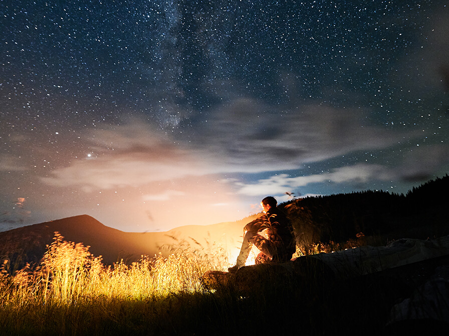 Midnight Moment of someone looking into the night sky, hoping for spiritual renewal.
