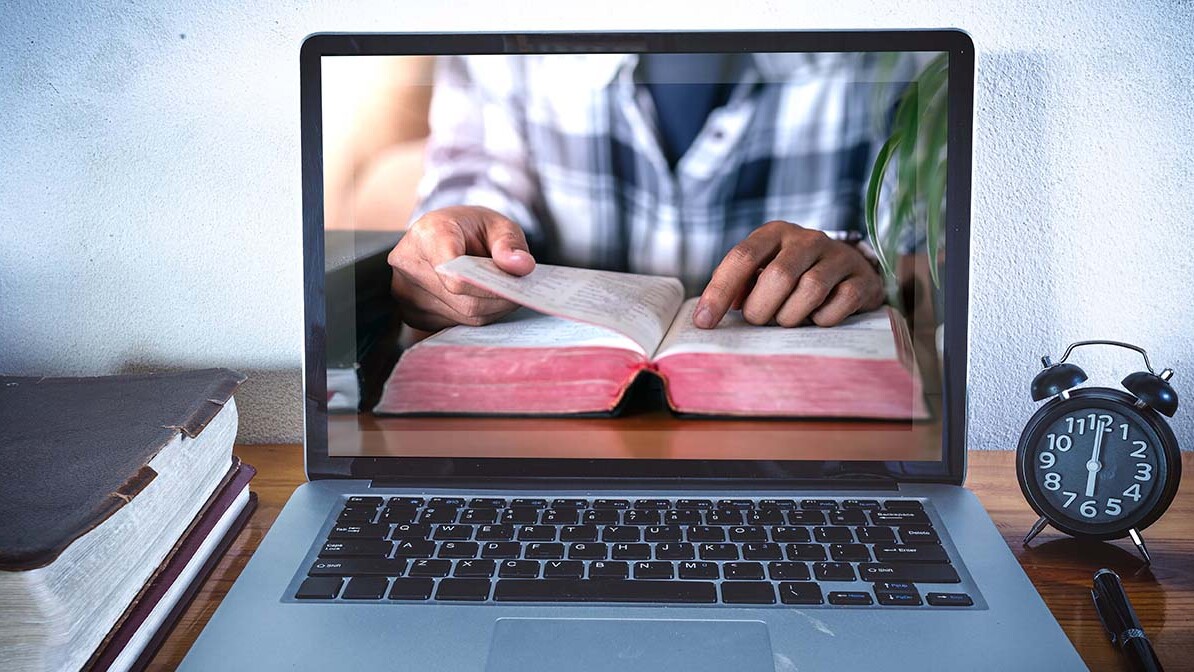 free daily devotional, Bible on a laptop screen, getting close to God through Inspiration Ministries' daily devotionals