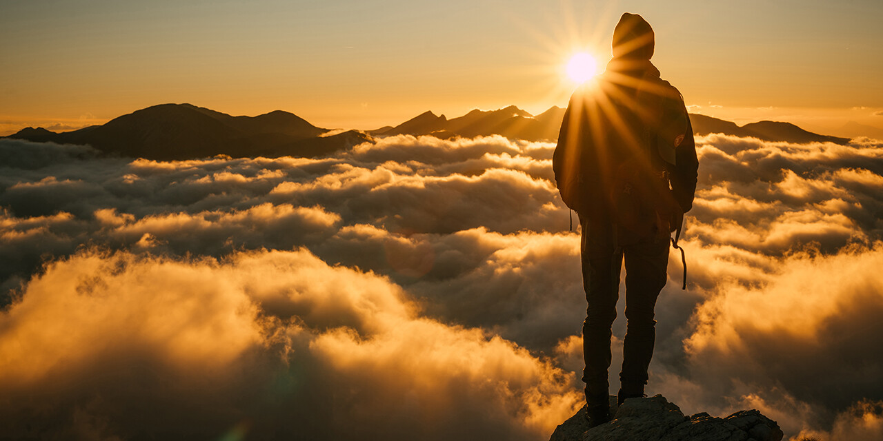 when you can’t see God working, man looking at fog from mountaintop