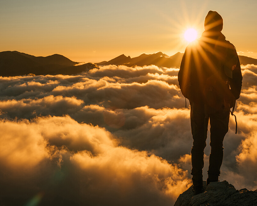 when you can’t see God working, man looking at fog from mountaintop